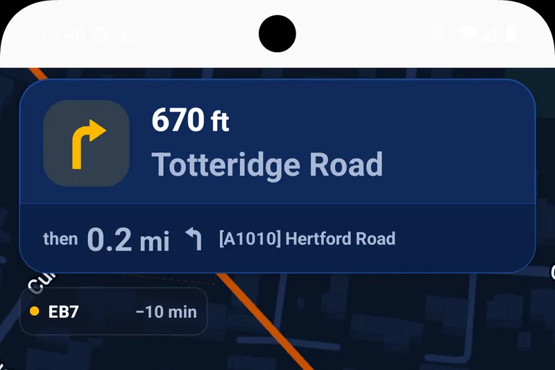 Navigation view with the next turn at the top and an attending
unit chip below it reading EB7, minus 10 minutes, with a yellow
en-route dot